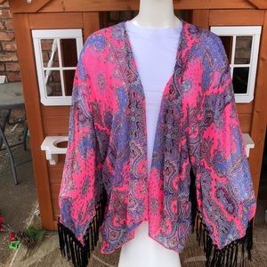 Stylebook pink and black fringe coverup.